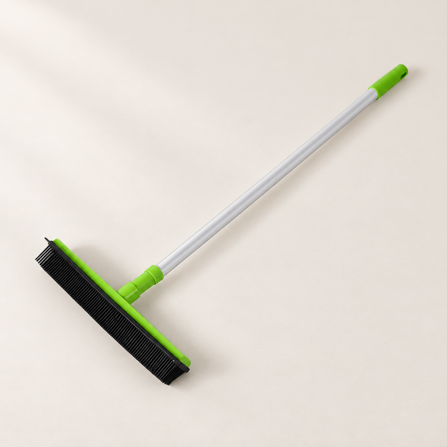 Rubber Pet Hair Broom on a softly lit neutral background