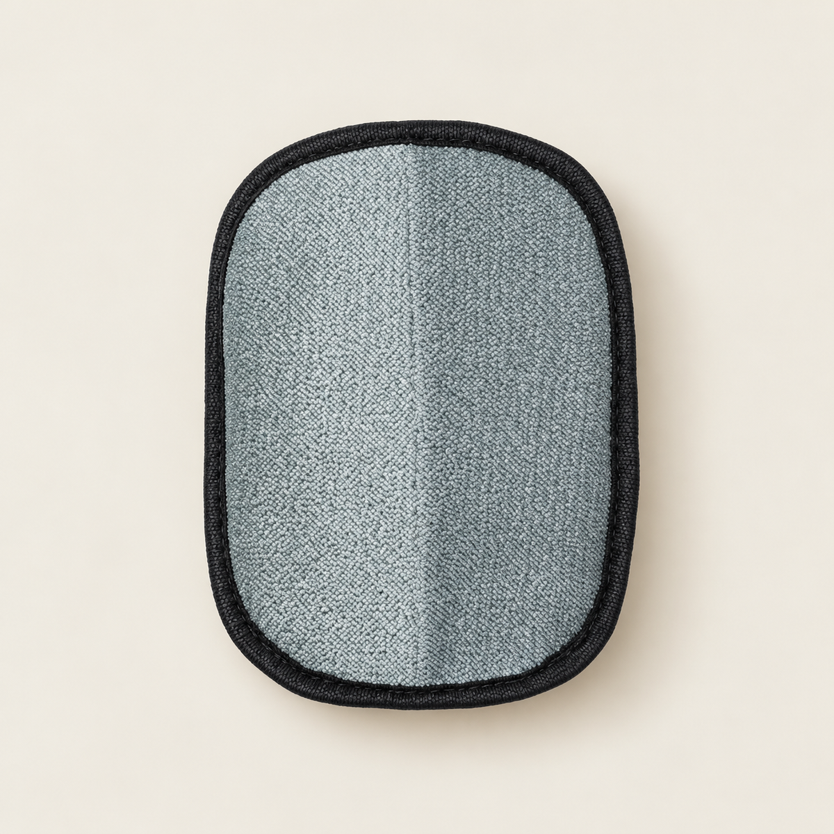 Fabric Hair Mitt on a softly lit neutral background